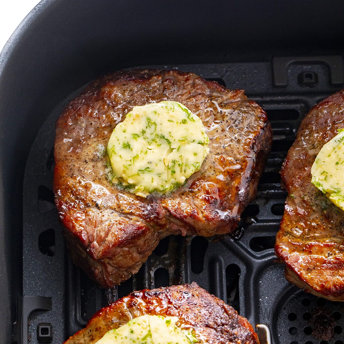 Grilling steak with butter